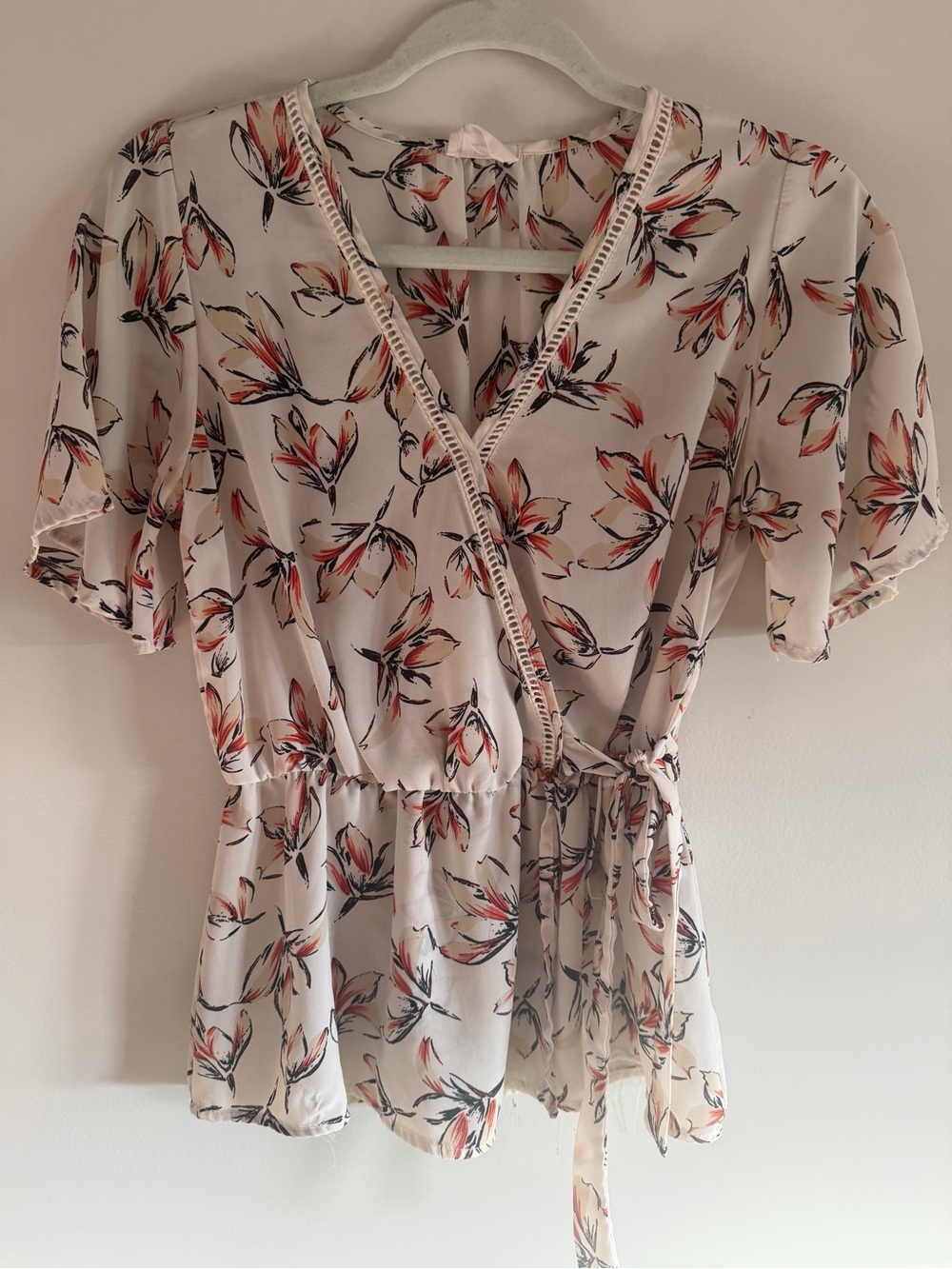 Sienna Sky White Floral Wrap Blouse with Coral & Black Accents